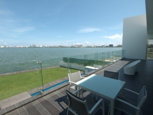 House for sale Isla Dorada Cancun – balcony overlooking the lagoon with hotels in the background